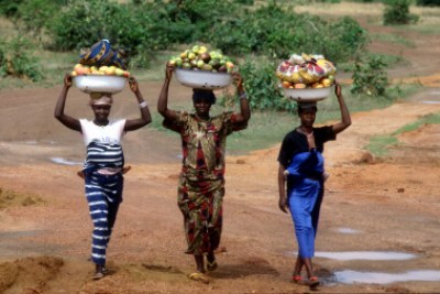 Women sell fruits and vegetables at market in Guinea Conakry