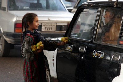 A young girl sells lemons in the streets of Cairo (file photo).