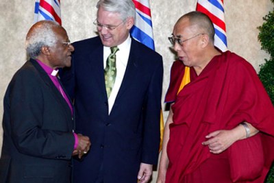 Premier Gordon Campbell greets Nobel Peace Prize Laureates Archbishop Desmond Tutu and His Holiness the Dalai Lama.