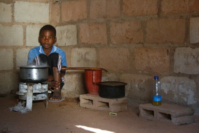 IMF says the country's poor people are benefiting less from growth, a Boy in the Kitchen in Mozambique.