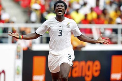 Asamoah Gyan, one of Ghana's goal-scorers, celebrates a goal at the last Cup of Nations tournament.