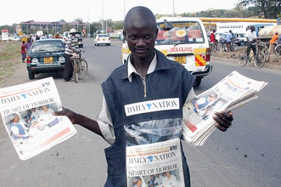 Vendor selling Nation Media Group papers.
