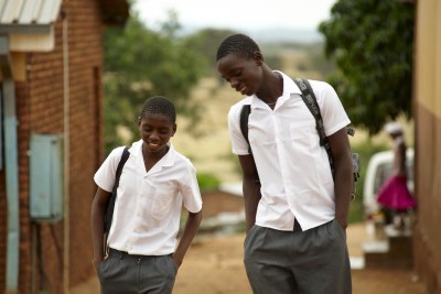 Lazarus and his schoolmate Hasani walk back to the boys shelter after finishing lessons for the day.