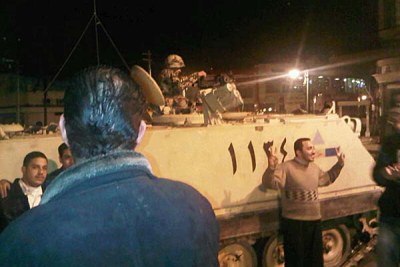 Soldiers talk to protesters in Alexandria, on January 28, 2011.