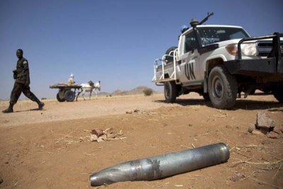 United Nations officers discover unexploded munitions in Darfur.