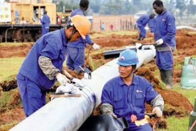 Engineers working on a pipeline.