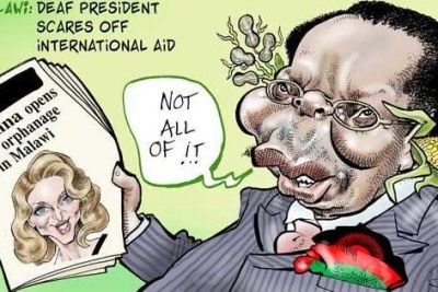 L'ancien président Bingu wa Mutharika du Malawi avec un portrait de la superstar Madonna.