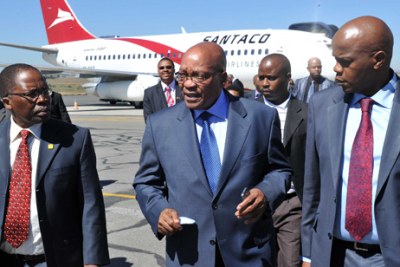 From left, Transport Minister Sibusiso Ndebele, President Jacob Zuma and South African National Taxi Council president Jabulani Mthembu during the launch of SANTACO Airlines at Lanseria Airport, Johannesburg.