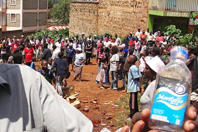 A resident of Muchatha village in Kiambu displays one of the brews 'Montello' alleged to have been consumed by four people who were found dead on September 19, 2011 morning.