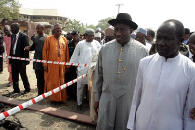 President Goodluck Jonathan visiting Madalla, outside the capital Abuja, where 44 people were killed during a Christmas bomb attack on a church.