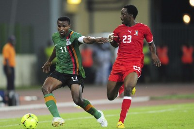 Jose Bokung Alogo of Equatorial Guinea challenges Zambia's Christopher Katongo, 11, during the final stages of the 2012 Afcon held in Equatorial Guinea.