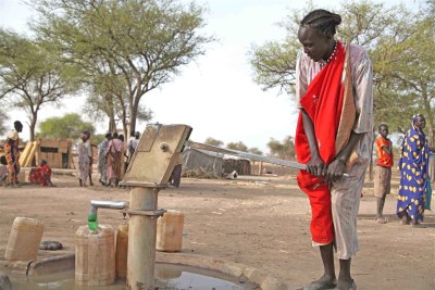 South Sudan woman fetching water.