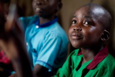 A boy listens to his teacher during a lesson on the outskirts of Juba, South Sudan.