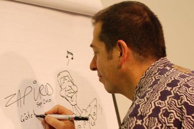 South African cartoonist Jonathan Shapiro, better known as Zapiro, drafts a cartoon of Nelson Mandela (file photo).
