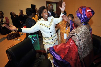 South Africa's International Affairs and Co-operation Minister Maite Nkoana-Mashabane congratulates Nkosazana Dlamini-Zuma on her election as the first woman leader of the African Union Commission.
