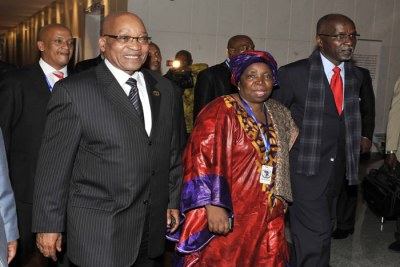 South African President Jacob Zuma walks with Home Affairs Minister Nkosazana Dlamini-Zuma after her election as the first woman leader of the African Union Commission.
