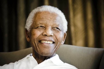 Nelson Mandela smiles during a meeting in Johannesburg in this file photo dated 2 June 2009. Mandela celebrates his 94th birthday on Wednesday.