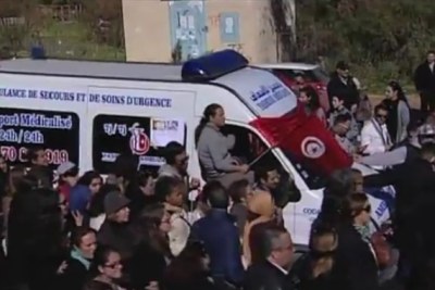 Supporters accompanied the ambulance carrying the body of Chokri Belaid, a vocal critic of the Islamist-led government who was shot in February.