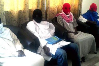 Members of a Boko Haram splinter group during a news conference.