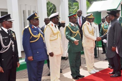 President Goodluck Jonathan (right) being received by service chiefs.