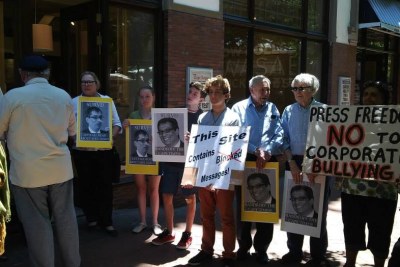 Demonstrators protest the dismissal of Alide Dasnois, former editor of the Cape Times.