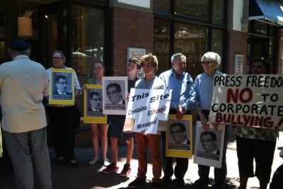 Demonstrators protest the dismissal of Alide Dasnois, former editor of the Cape Times.