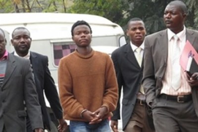 Romeo Tanyaradzwa Musemburi being taken to court facing charges linked to Baba Jukwa (file photo).