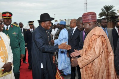 President Goodluck Jonathan with Senator Ali Sheriff (right) and other members of the presidential entourage on their arrival in Ndjamena.