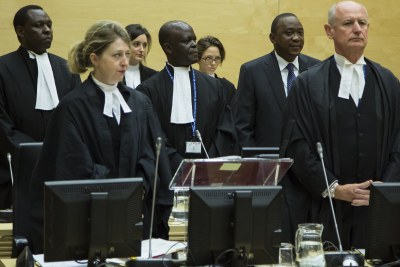 President Uhuru Kenyatta among his defence lawyers at the International Criminal Court.