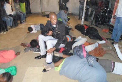 A pastor sitting on top of congregants (file photo).