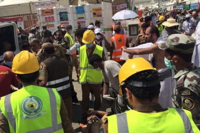 Members of Saudi civil defence try to rescue pilgrims following a crush caused by large numbers of people pushing at Mina, outside the holy city of Mecca.