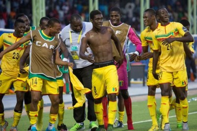 Yves Bissouma (shirt-less) leads his teammates in celebrations after scoring the only goal in Mali's 1-0 win over Ivory Coast 1-0.