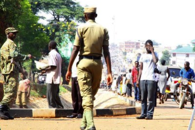 Police officers and soldiers patrolling in Gulu.