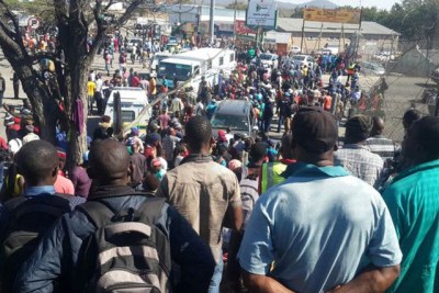 Protesters march against the government's ban on imports into Zimbabwe