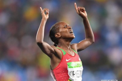 Kenya's Faith Chepngetich Kipyegon celebrates after winning gold in Rio.