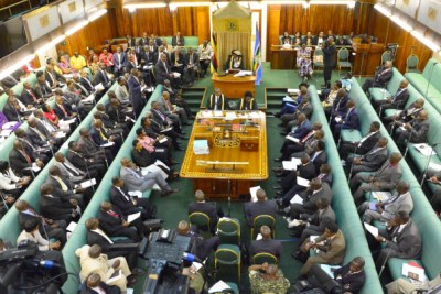 MPs discuss during a plenary session chaired by the Speaker of Parliament, Ms Rebeca Kadaga.
