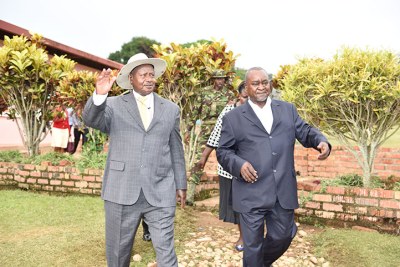 Gilbert Bukenya with President Museveni at his hotel in Katomi recently.