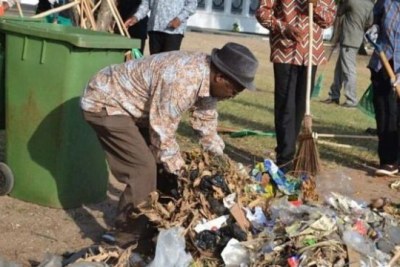 President John Magufuli during a city cleaning campaign.