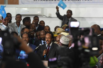 The newly elected president of Somalia, Mohamed Abdullahi Farmajo (centre) makes an acceptance speech after he was sworn into office at the Mogadishu Airport hangar on February 8, 2017.