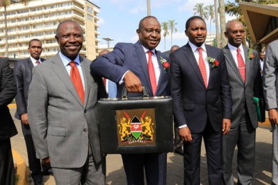 National Treasury Cabinet Secretary Henry Rotich, centre, with other cabinet members before presenting the 2016/17 budget (file photo).