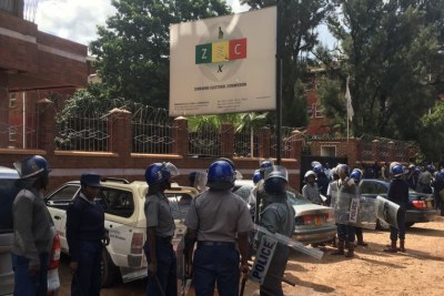 Police at the Zimbabwe Electoral Commission offices.