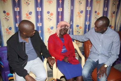 Nandi Hills MP Alfred Keter, left, and Kapsaret MP Oscar Sudi console Ebby Isaji, wife of James Ratemo Onsare, a ward rep aspirant for Kapsoya Ward following the death of her three sons.