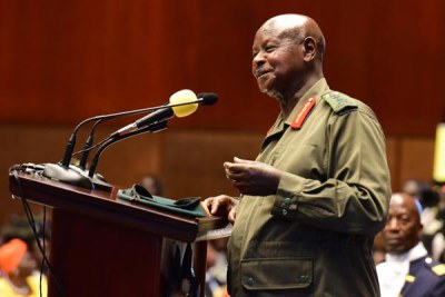 President Museveni speaking at the budget reading wearing military uniform.
