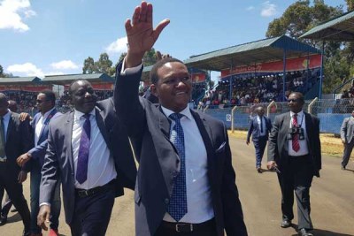 Machakos Governor Alfred Mutua and his new deputy Francis Maliti waving at the crowd before they were sworn in.