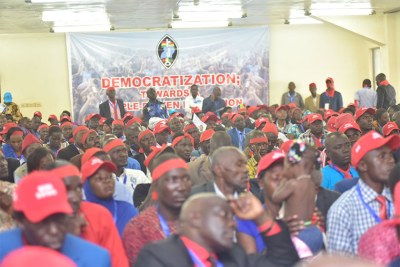 Forum for Democratic Change delegates donning red ribbons and caps over the weekend ahead of elections for party president. Red ribbons are a national symbol against the age limit amendment.
