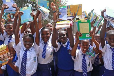 Kisumu Girls High School students celebrate after receiving textbooks from the national government (file photo).