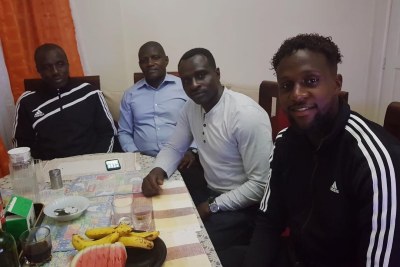 Belgian striker Divock Origi (right) with his dad Mike Okoth (second right) and uncles in Nairobi (file photo).