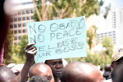 Migori Governor Okoth Obado's supporters protest outside Milimani Law Courts, where he pleaded not guilty to murder charges, on September 24, 2018.