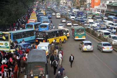 Matatus pick up passengers along Murang'a Road in nairobi on December 3, 2018 when a ban prohibiting them from accessing the CBD took effect.