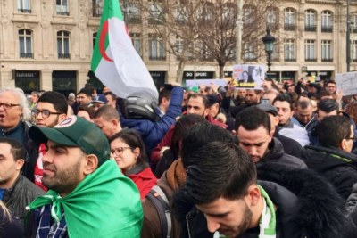 Algerians protested at the Place de la Republique in central Paris against Bouteflika's intention to seek another term in office.